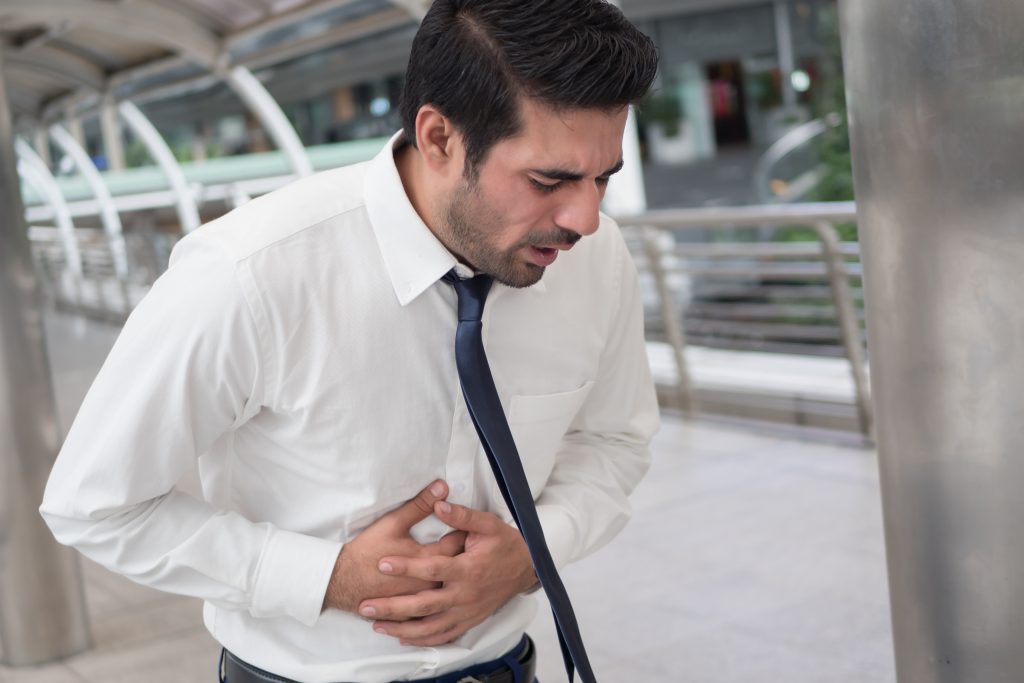 Sick,Unhealthy,Asian,Man,Suffering,From,Stomachache,,Diarrhea,,Food,Poisoning,