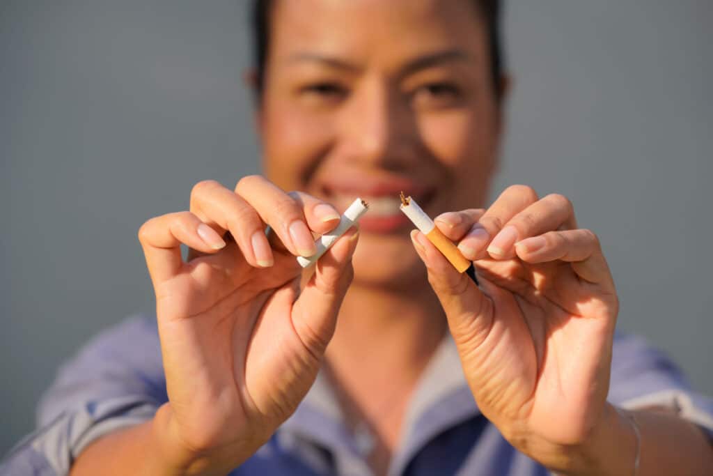 Close-up,Photo,Of,A,Woman,Destroying,Cigarettes,,World,No,Tobacco