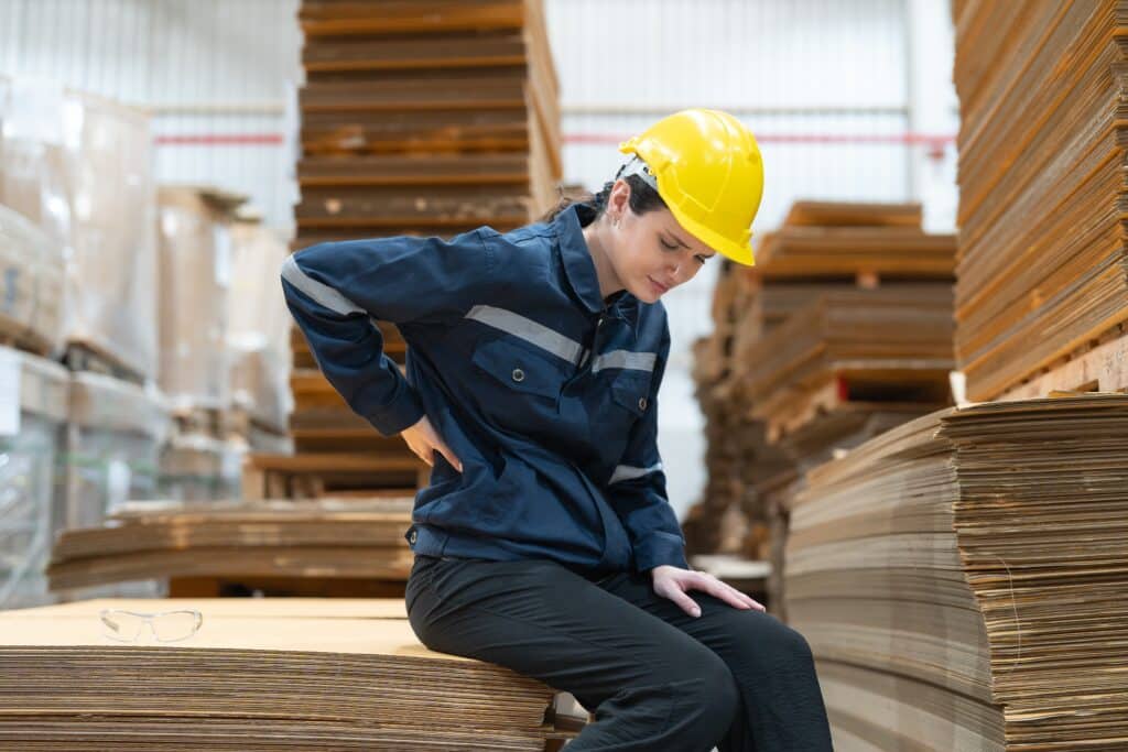 Female,Warehouse,Worker,In,A,Yellow,Helmet,And,Blue,Uniform