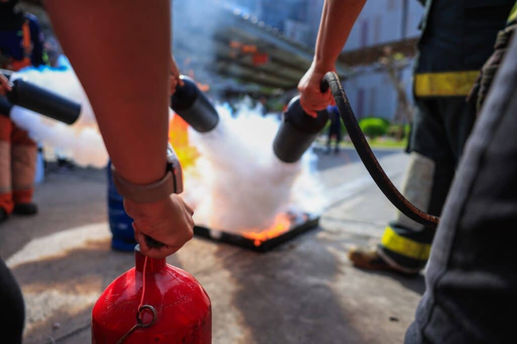Company,Employees,Are,Undergoing,Basic,Fire,Extinguishing,Training,,Fire,Extinguisher